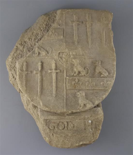 A carved limestone heraldic shield, pre-1500, W.11in. H.14in.